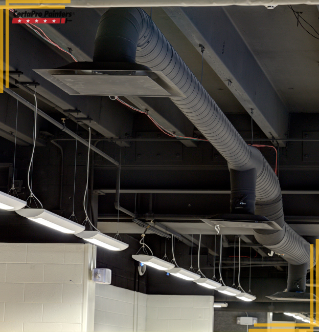 black painted ceiling with exposed ductwork